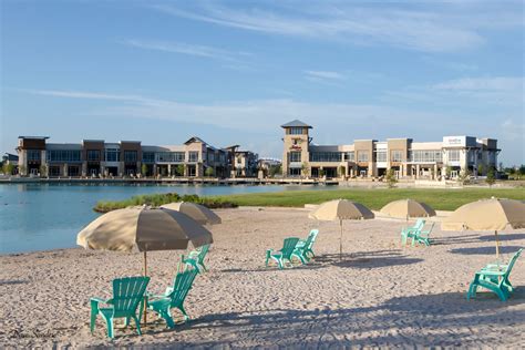 The boardwalk at towne lake - “We've lived here since July 2015. We are friends with the owners/managers of every major restaurant at the Boardwalk, have great friends in the neighborhood; I play live music at the Boardwalk once each month; we workout less than 100 yards from our house we drive our golf cart to the grocery store, and we watch the rippling …